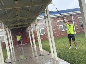 PSI OFF crew pressure washing the walkway canopy at Hazel Green Elementary School, Hazel Green AL