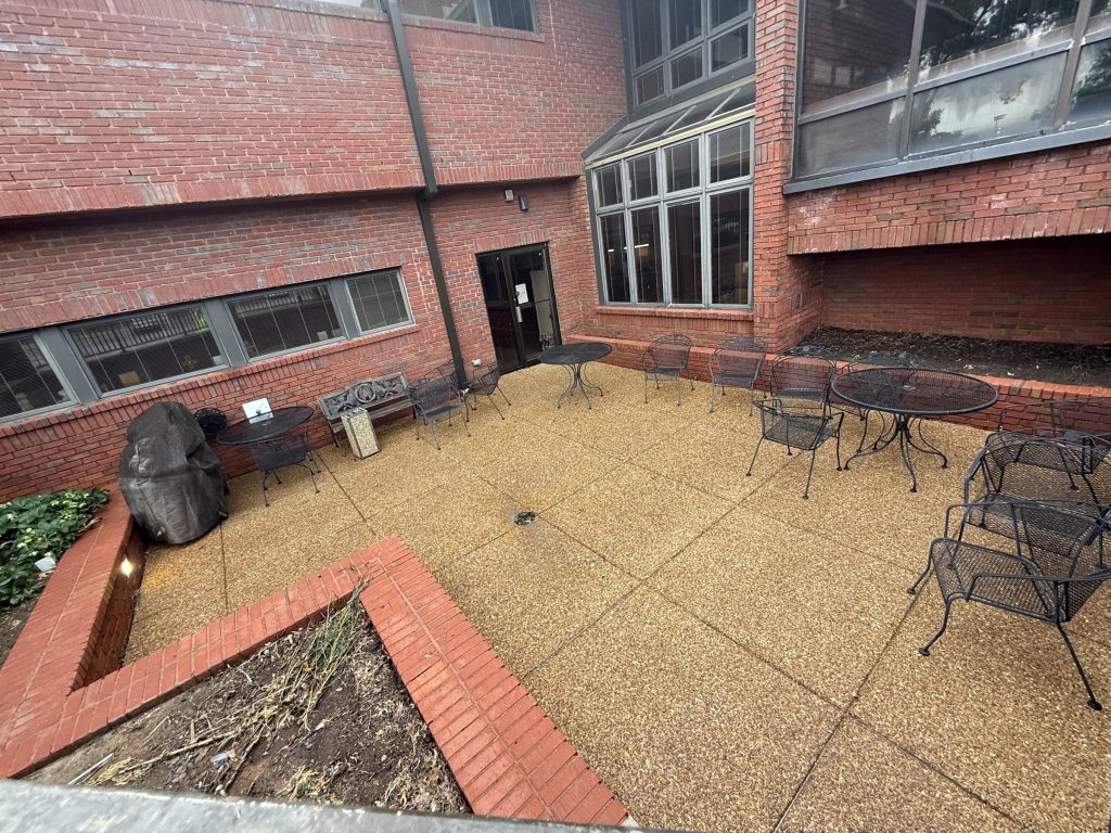 Employee patio aggregate concrete after cleaning at Hospice Family Care in Huntsville, AL