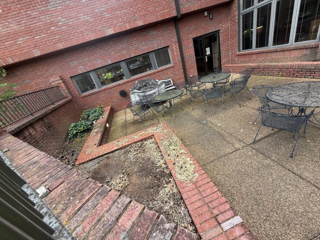 Employee patio before cleaning, second angle, at Hospice Family Care in Huntsville, AL