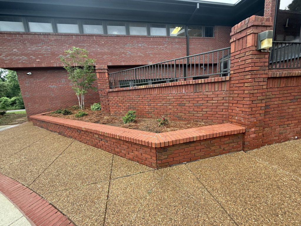 Brick retaining wall after cleaning at Hospice Family Care in Huntsville, AL